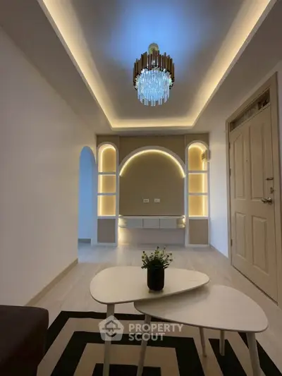 Modern living room with elegant lighting and stylish decor