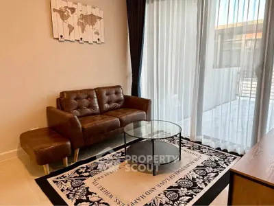 Stylish living room with leather sofa and glass coffee table, modern decor