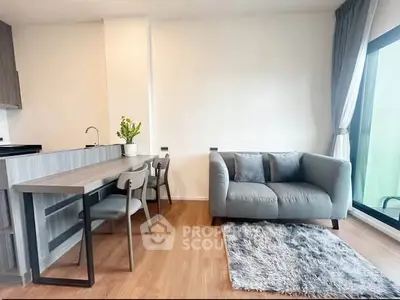 Modern living room with cozy sofa, stylish dining area, and large window for natural light.