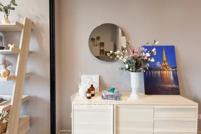 Stylish interior with modern decor and elegant shelving in a cozy living space.