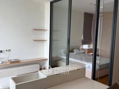 Modern bedroom with sliding glass doors and minimalist design