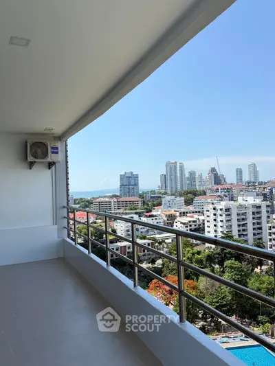 Spacious balcony with stunning cityscape view in a high-rise building