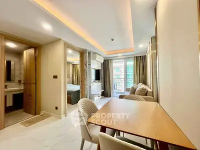 Modern open-plan living room with dining area and view of balcony in luxury apartment