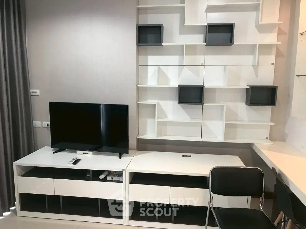Modern living room with sleek TV stand and stylish shelving unit