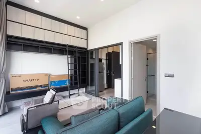 Modern living room with smart TV and stylish furniture in a contemporary apartment.