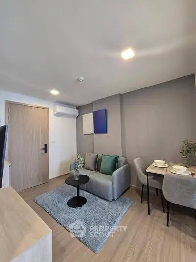 Modern living room with cozy sofa and dining area in stylish apartment