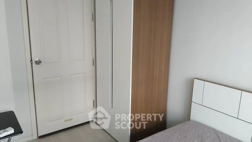 Cozy bedroom with modern wardrobe and minimalist design