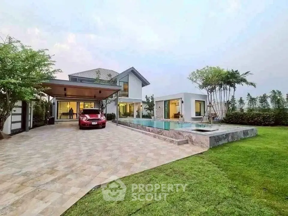 Luxurious modern home with pool and spacious driveway