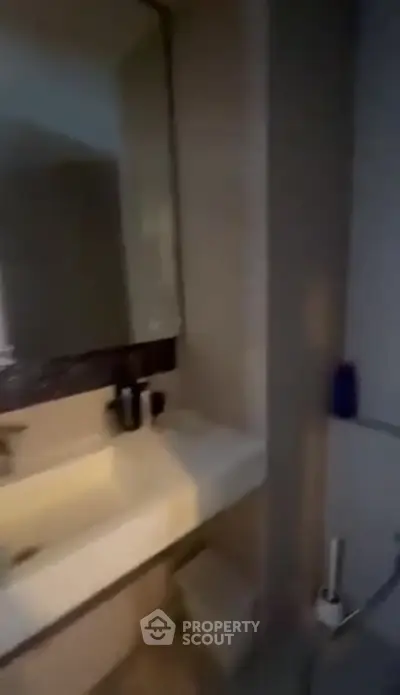 Modern bathroom with sleek sink and mirror design