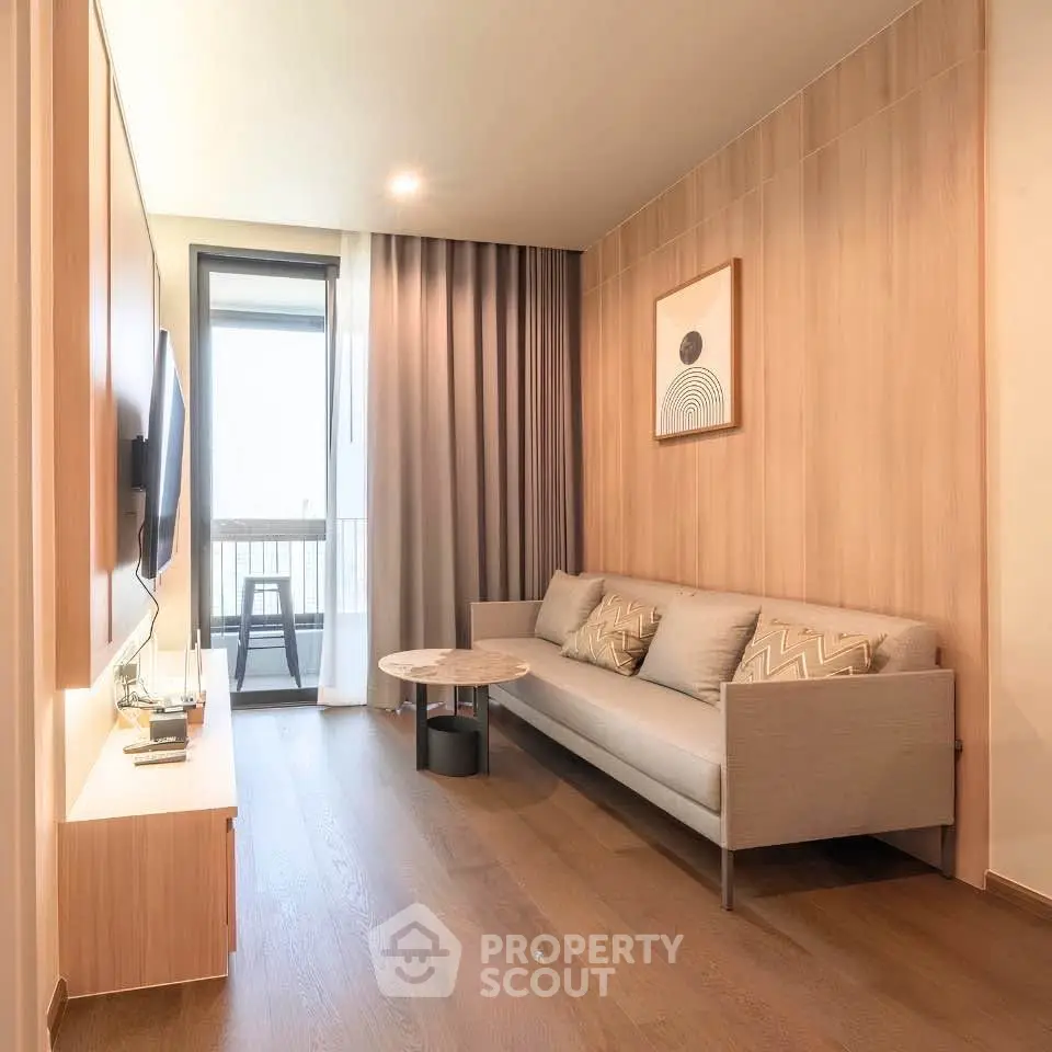 Modern living room with sleek design, wooden flooring, and a cozy sofa, perfect for relaxation.