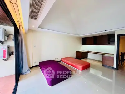 Spacious living room with modern design and unique ceiling architecture.