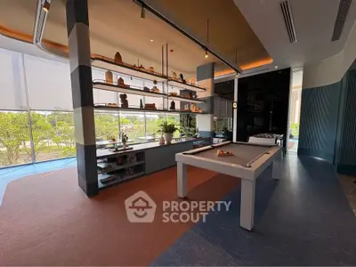 Luxurious modern interior with pool table and stylish shelving, perfect for entertainment and relaxation.