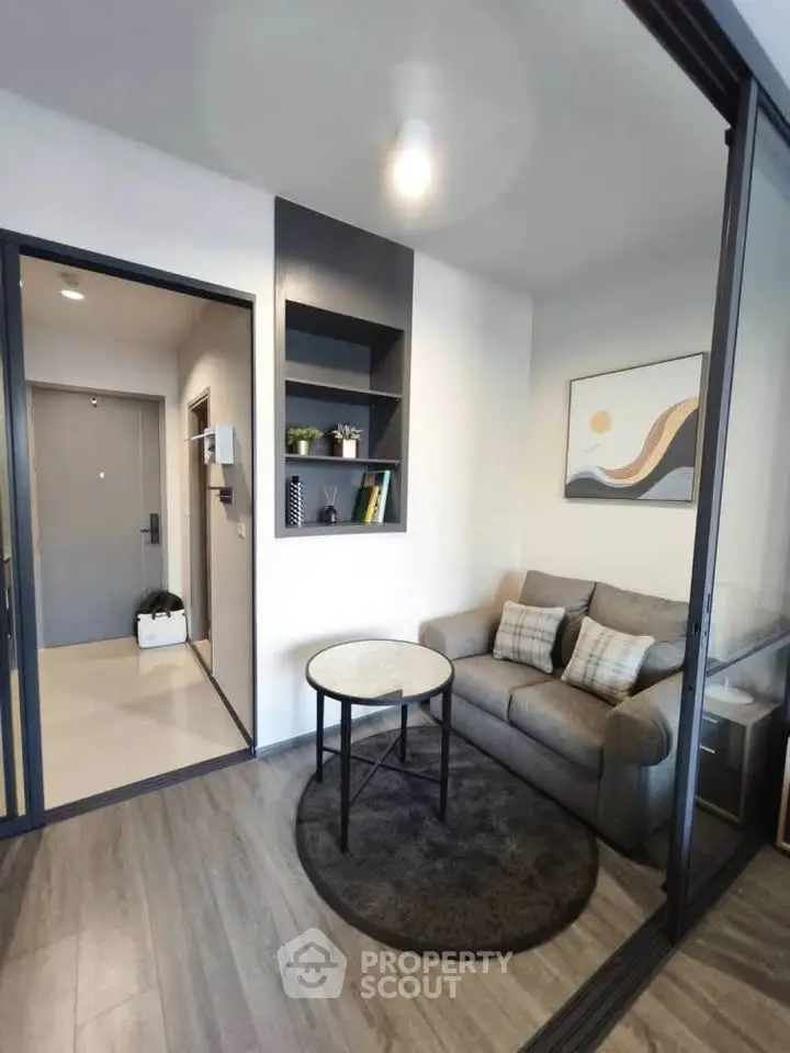 Modern living room with stylish decor and cozy seating area in a contemporary apartment.