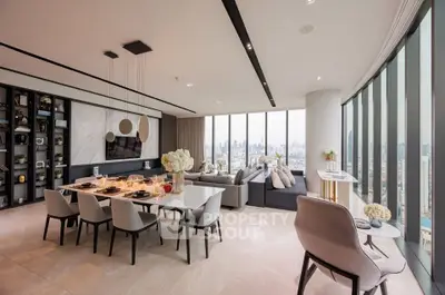 Luxurious open-plan living and dining area with panoramic city views, elegant decor, and abundant natural light.
