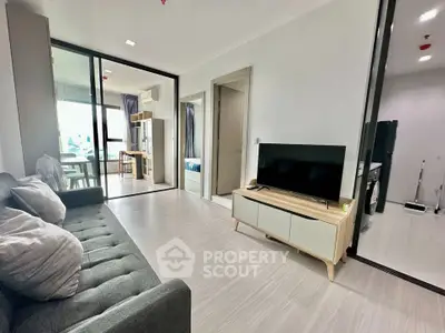 Modern living room with sleek furniture and open layout in a stylish apartment.