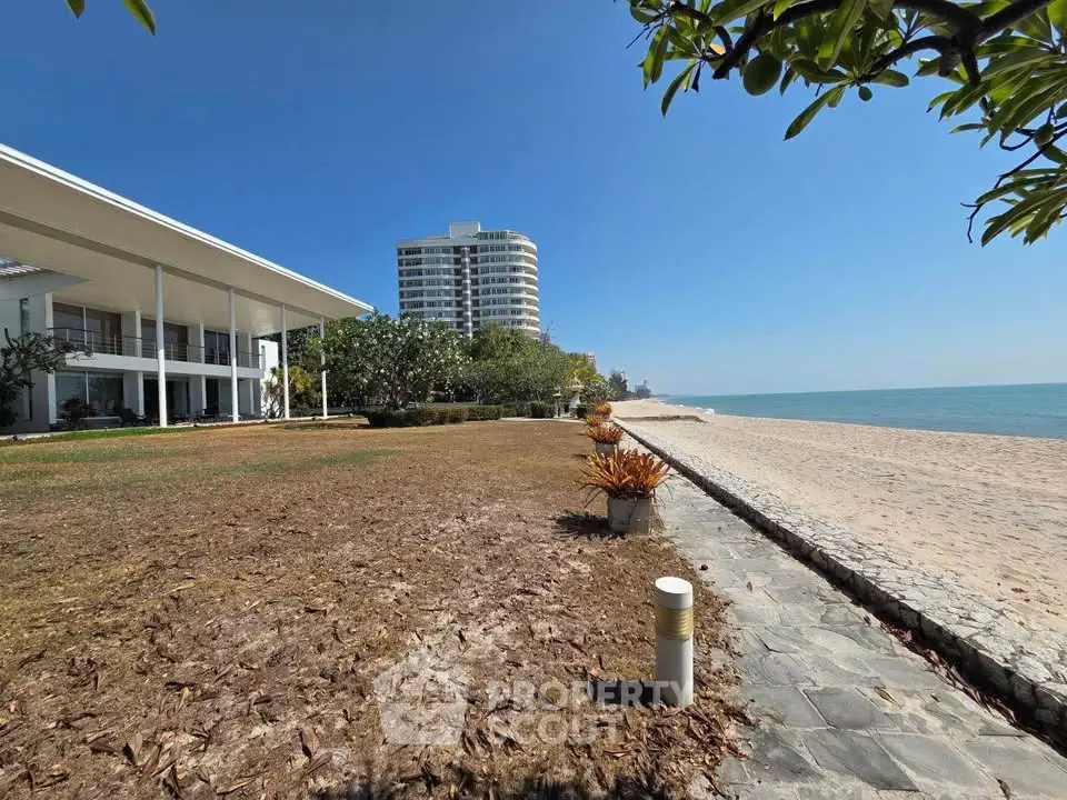 Beachfront property with modern architecture and ocean view, perfect for luxury living.