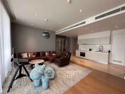 Spacious modern living room with open kitchen and stylish decor