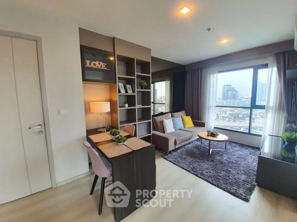 Modern living room with city view, cozy seating, and stylish decor