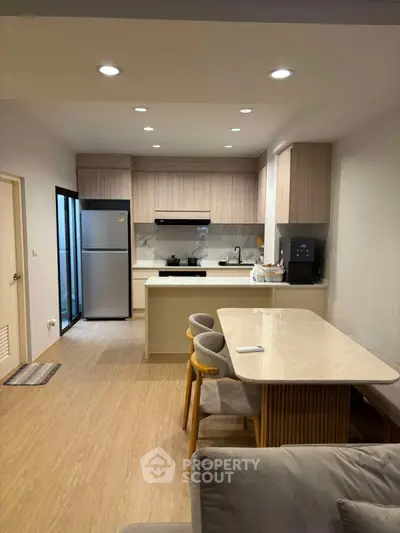 Modern kitchen with open layout and sleek dining area
