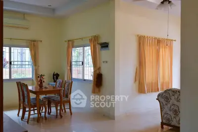 Spacious living room with dining area and elegant decor