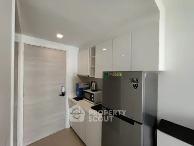 Modern kitchen with sleek appliances and ample storage space