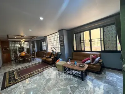 Spacious living room with elegant decor and ample natural light