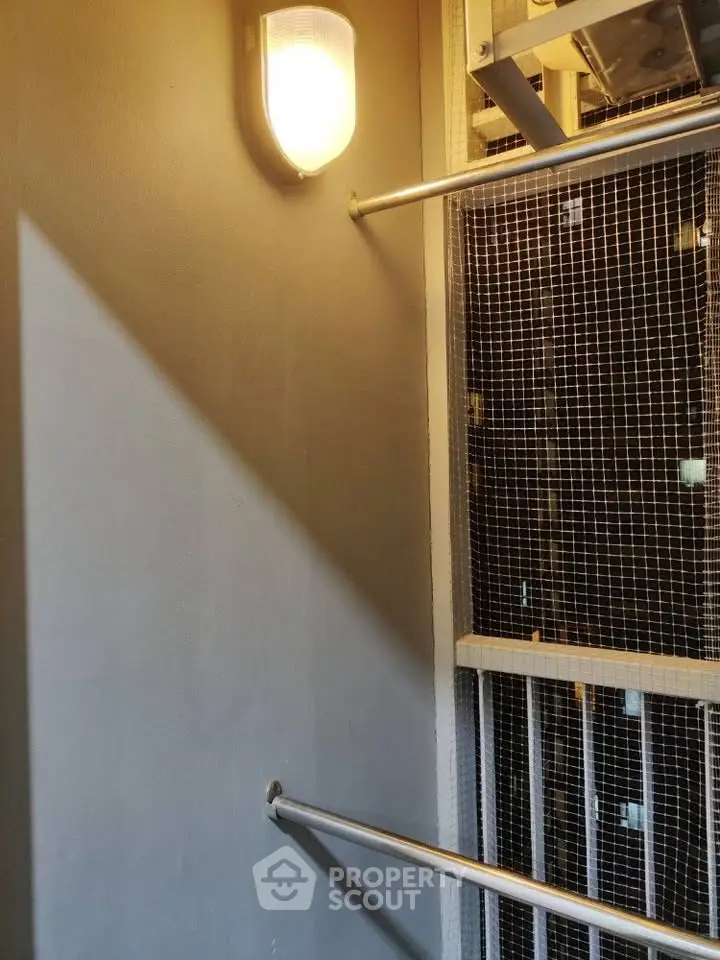 Modern elevator interior with sleek lighting and safety features.