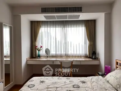 Charming bedroom with large window, elegant curtains, and cozy decor, perfect for relaxation and comfort.