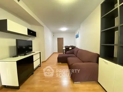 Spacious living room with modern furniture and wooden flooring