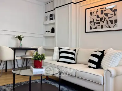 Stylish modern living room with elegant decor and cozy seating area.