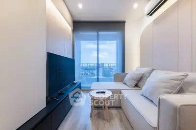 Modern living room with sleek design and stunning city view from balcony.