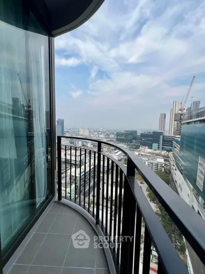 Stunning high-rise balcony with panoramic city view, perfect for urban living.
