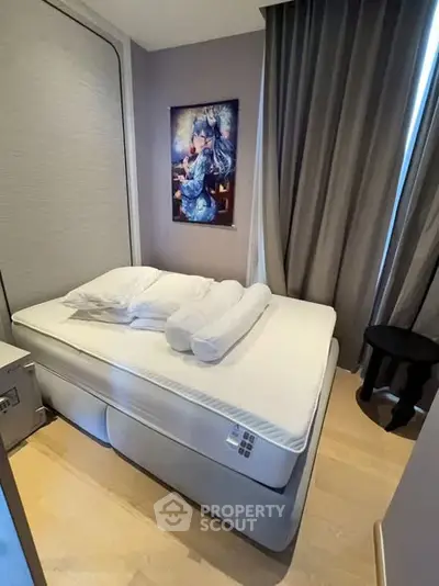 Cozy bedroom with modern decor and elegant curtains