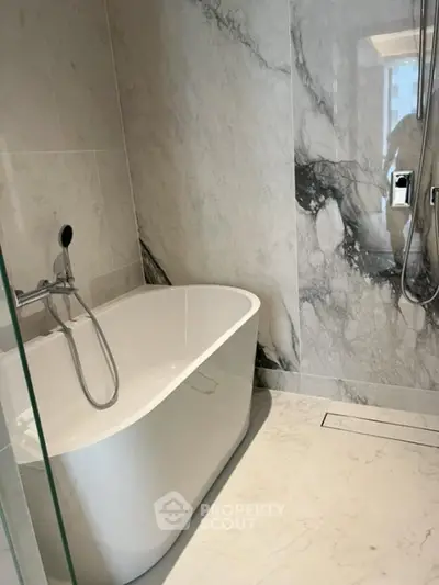 Luxurious bathroom with elegant marble walls and modern bathtub