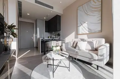 Modern living room with elegant decor and natural light in a stylish apartment.