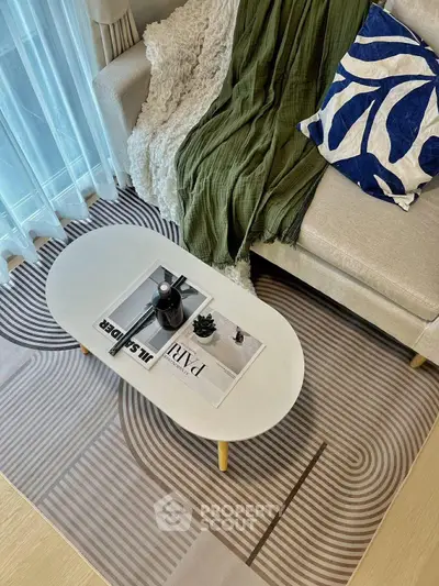 Stylish living room with modern decor, cozy sofa, and elegant coffee table, perfect for relaxation.