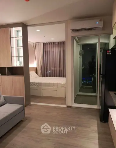 Modern studio apartment with sleek design and cozy bedroom area