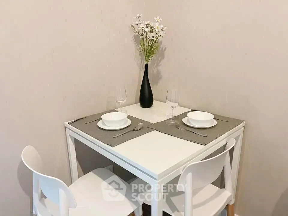 Cozy dining nook with elegant table setting and modern chairs