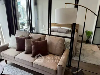 Modern studio apartment with cozy living area and stylish bedroom, featuring floor-to-ceiling windows and chic decor.