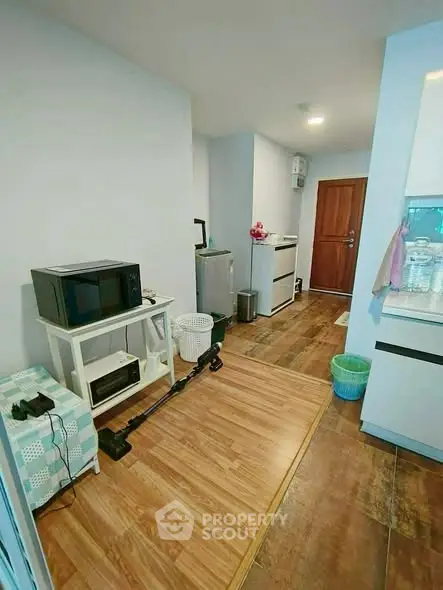 Compact kitchen with modern appliances and wooden flooring