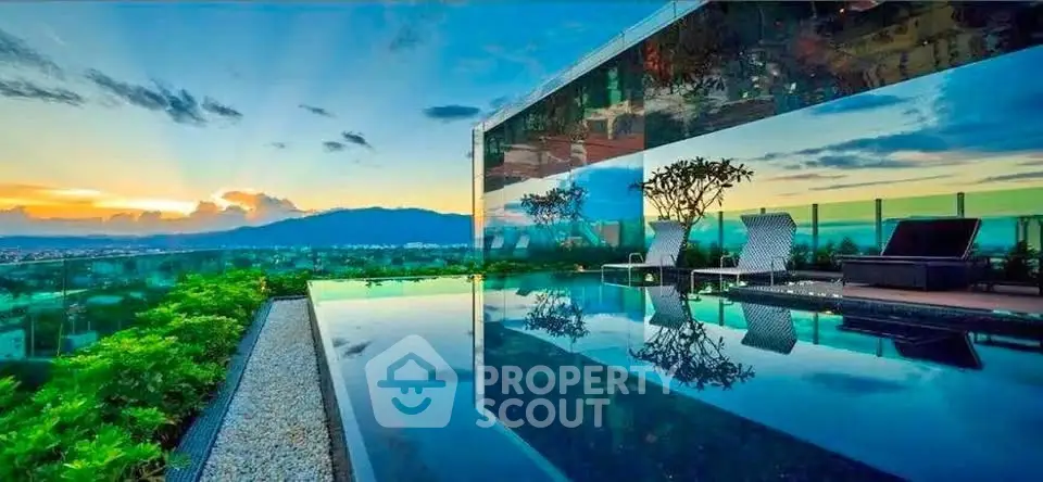Luxurious rooftop pool with stunning sunset view and modern design.