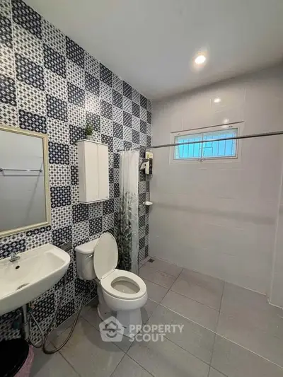 Modern bathroom with stylish tile design and open shower layout