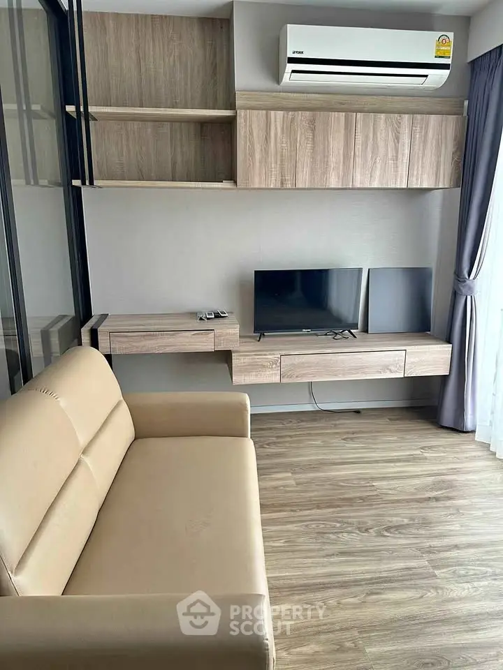 Modern living room with sleek wooden furniture and air conditioning