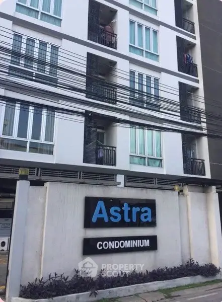 Modern Astra Condominium exterior with sleek design and multiple balconies.