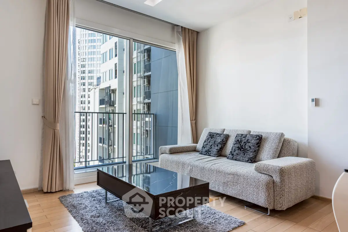 Modern living room with city view, stylish sofa, and elegant decor