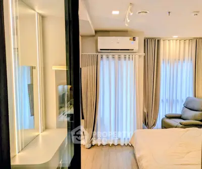 Modern bedroom with stylish decor and natural light, featuring a cozy bed and elegant curtains.
