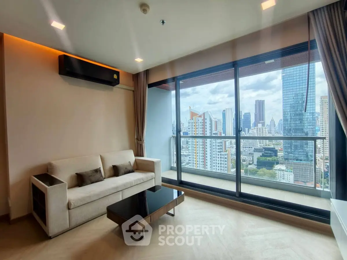 Modern living room with city view and large balcony in high-rise apartment