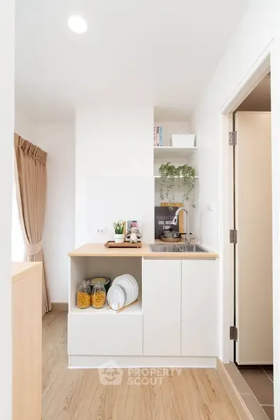 Modern compact kitchen with open layout and stylish decor