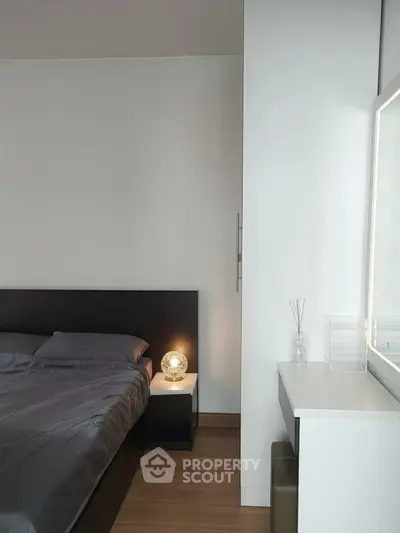 Modern bedroom with sleek design and ambient lighting