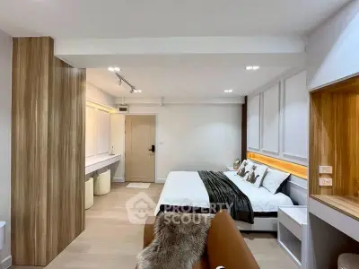 Modern bedroom with stylish wood accents and cozy lighting